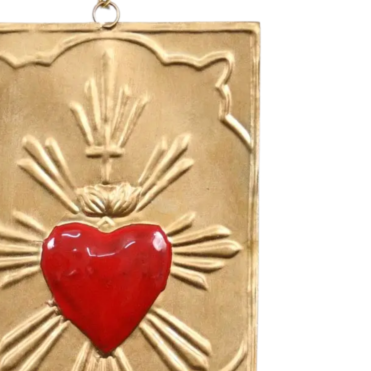Decorative plaque with a red heart and gold rays on a white background