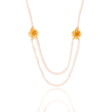 Long pearl statement necklace with clover